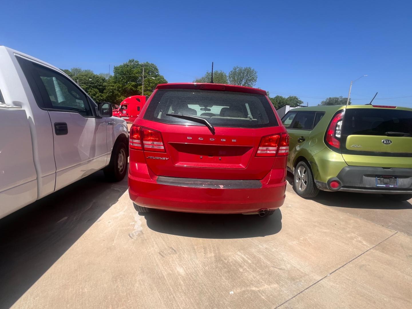 2014 RED DODGE JOURNEY SE SE (3C4PDCAB9ET) with an 2.4L L4 DOHC 16V engine, 4-Speed Automatic transmission, located at 8101 E. Skelly Dr., Tulsa, OK, 74129, (918) 592-3593, 36.121891, -95.888802 - Photo#2